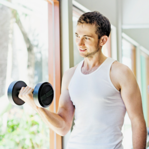 man lifting weights for weight loss